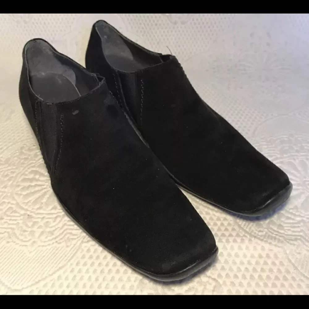 Stuart Weitzman black suede slip ons